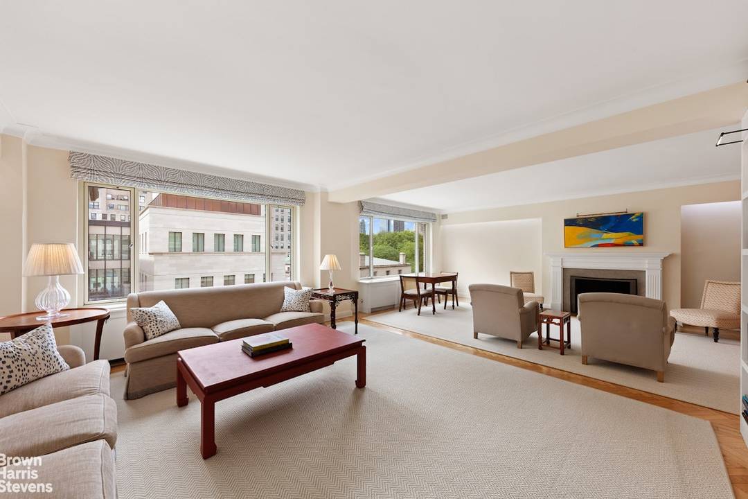 This spacious light filled three bedroom plus open library duplex enjoys soaring views over the Frick and Central Park from all major rooms.