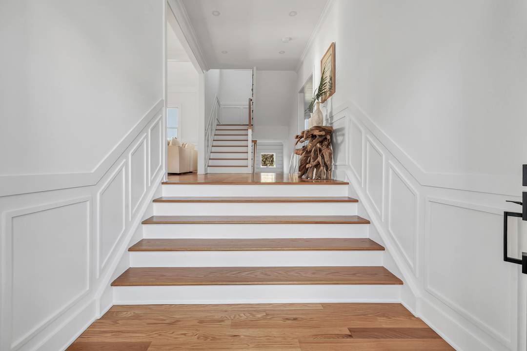 New Construction Coastal Home in the coveted Laurel Beach community offering 6 bedrooms and 3.