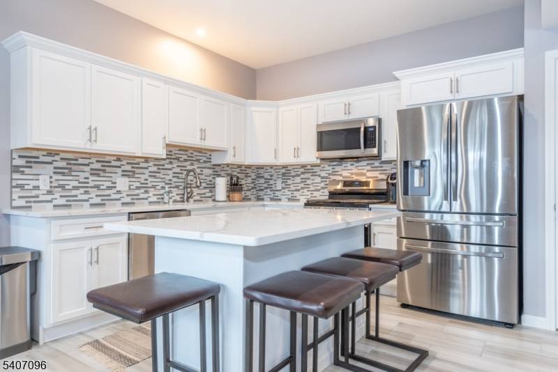 Experience elevated lakefront living in this stylish townhouse overlooking Greenwood Lake.