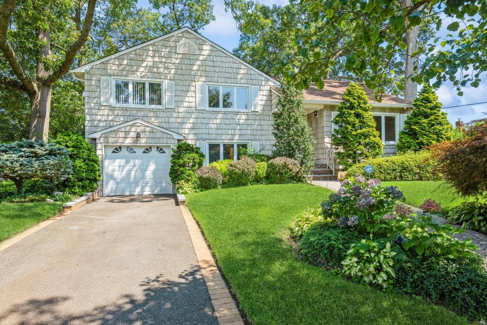 This spacious Split Level home offers comfortable, centrally located Nassau County living at its best.