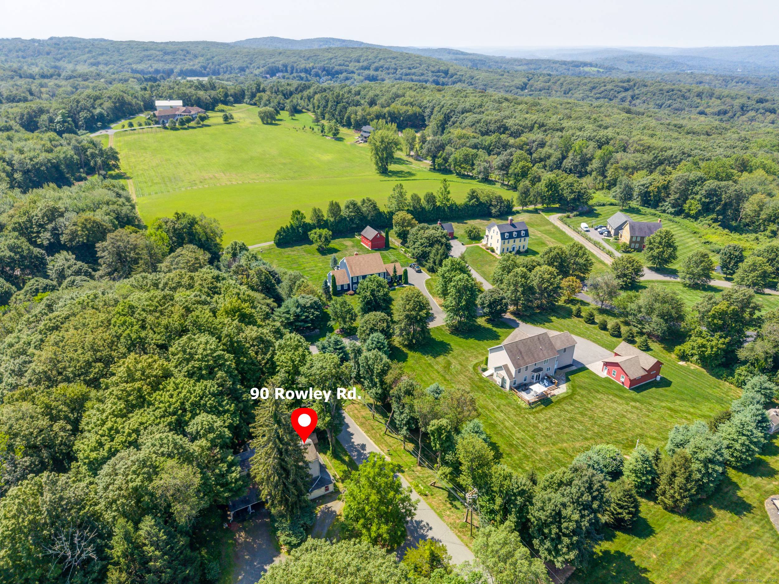 Set on a scenic lot in Woodbury, this property offers a rare combination of space, versatility, and untapped potential.