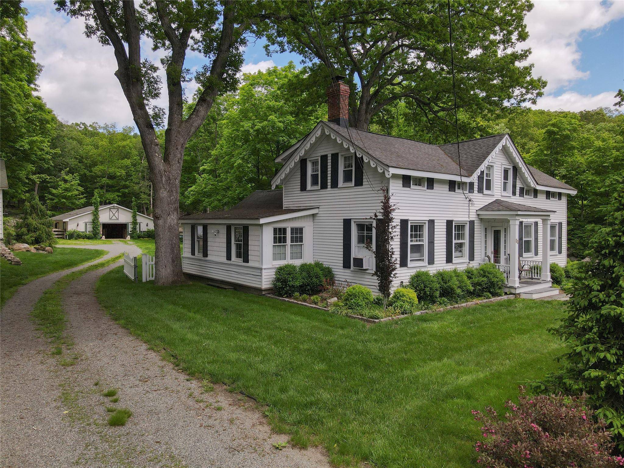 Welcome to 52 Eagle Valley Rd, a charming colonial home set on almost two acres, immediately adjacent to additional Town Parklands expanding your backyard.