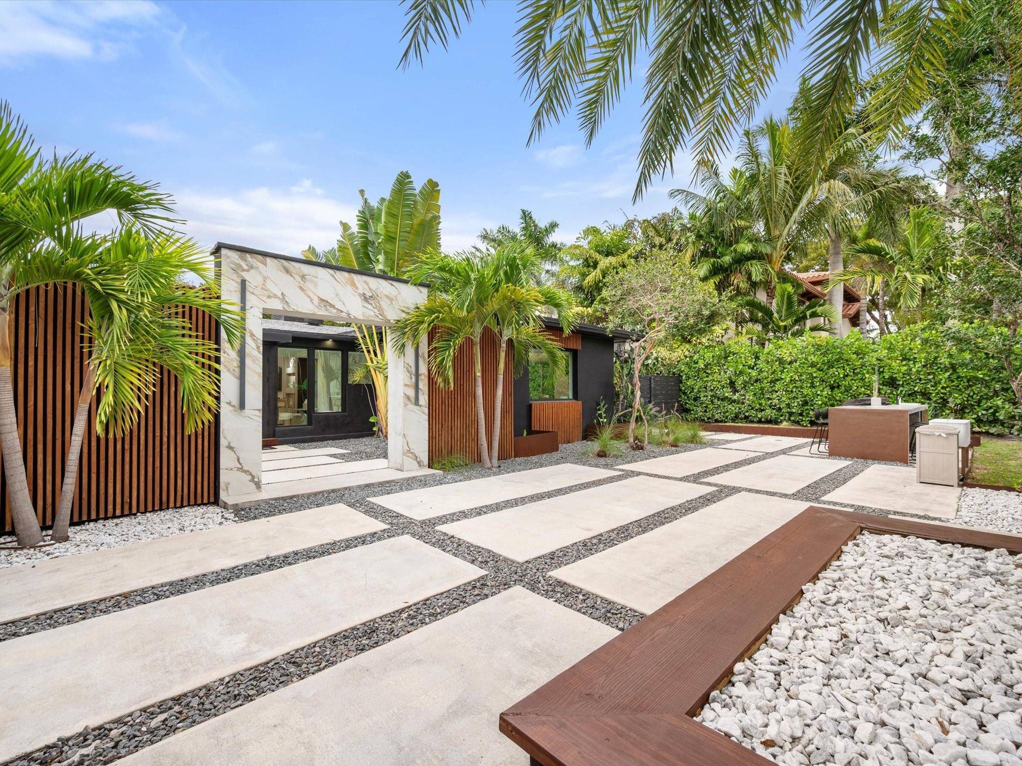 LUXURY updated 4 bedroom 3 bathroom SMART home in Coral Ridge, offering complete PRIVACY behind a steel gate on a 10, 000 SF lot, minutes from the beach, dining, and ...