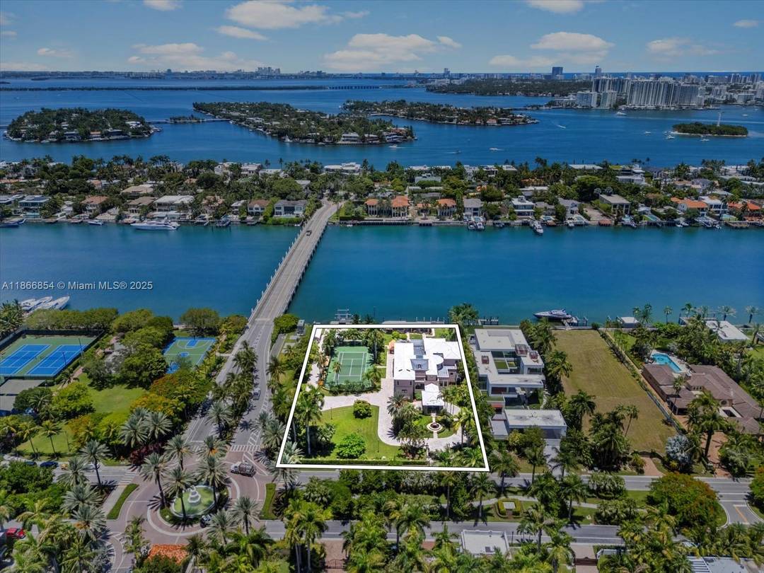 An extraordinary double lot canvas on coveted Palm Island, this rare assemblage spans 60, 000 SF with 200 feet of prime water frontage.