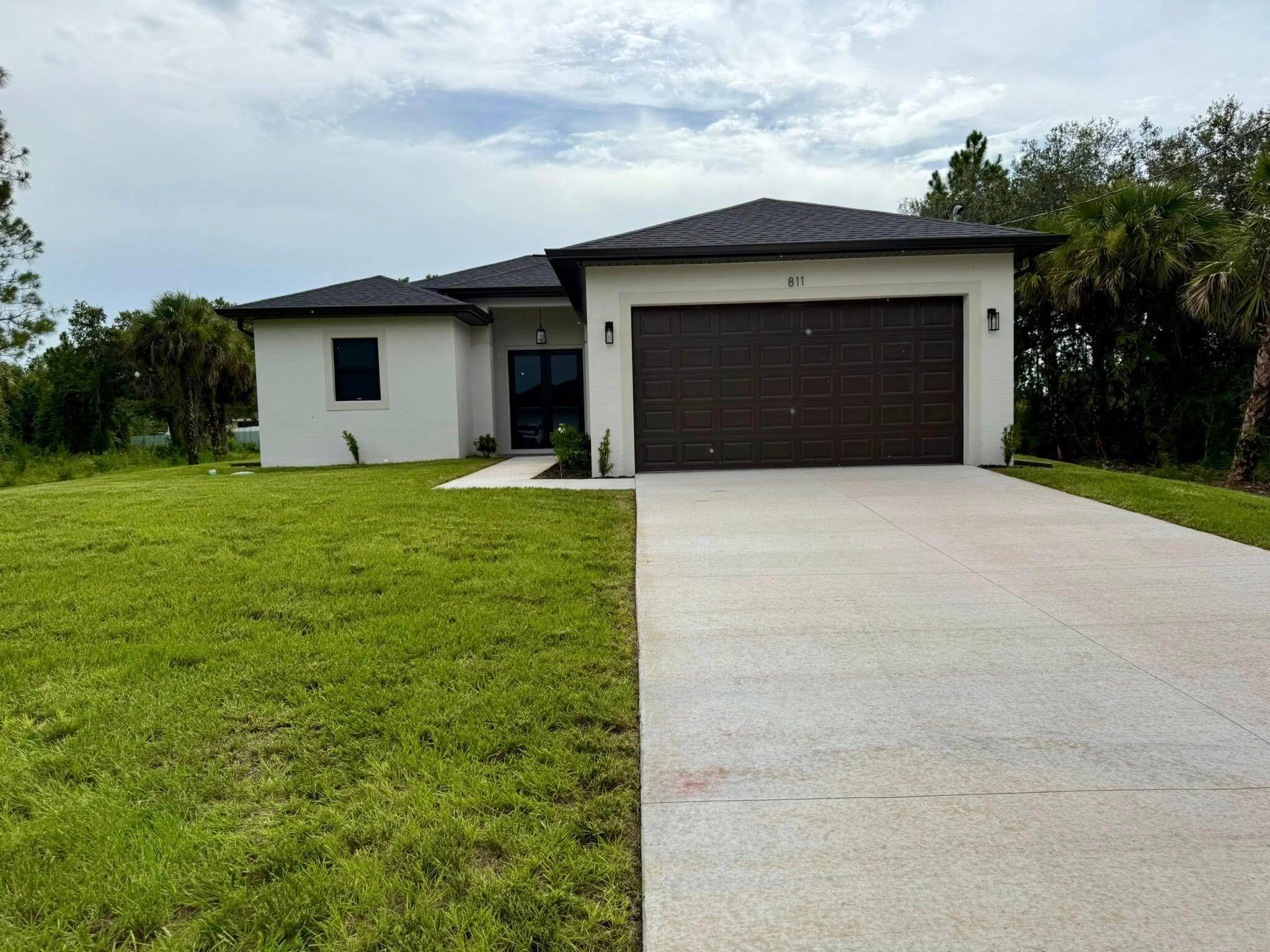 Beautiful new construction property set on half an acre of land in a peaceful area of Lehigh Acres an ideal place for you and your family to call home.
