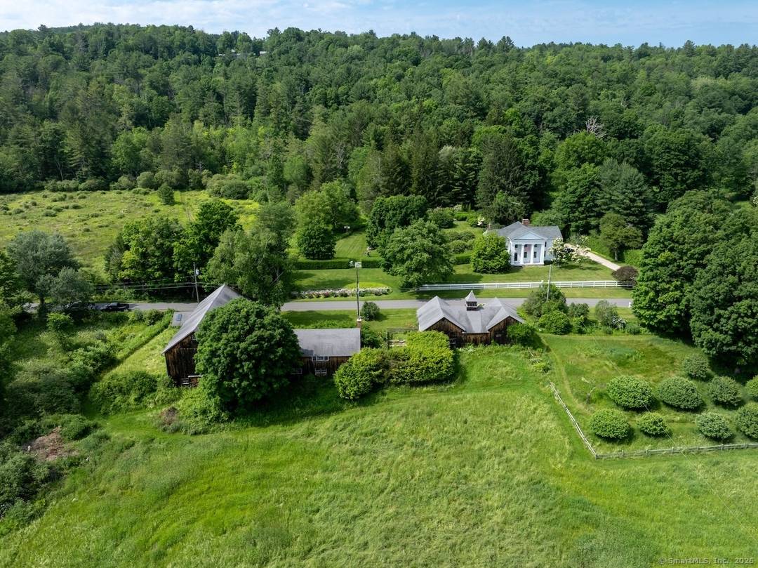 A rare and storied offering, the Colonel Dwight Wellington Pierce Farmstead is a distinguished circa 1830 Greek Revival residence listed on the State Registry of Historic Places.