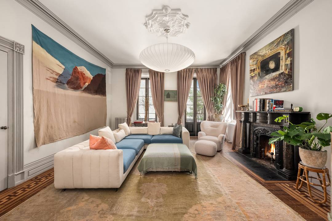 Perfectly positioned on the coveted corner of Cranberry and Willow Streets in the Brooklyn Heights Historic District, this 26 wide townhouse with a driveway on Willow Street opens onto the ...