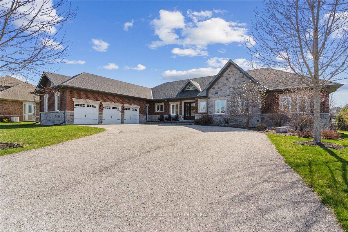 Nestled on an expansive 1 acre lot with over 100 ft of frontage and more than 300 ft of depth, this custom built bungalow is the perfect balance of country ...