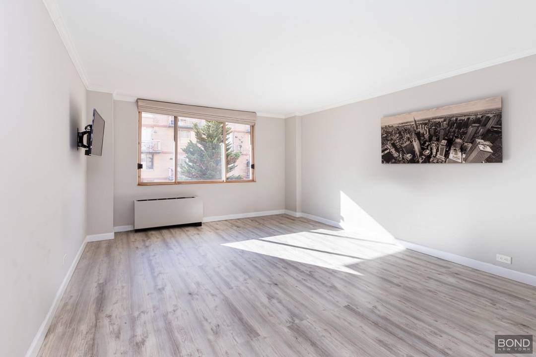 Bright, south facing studio in the Hells Kitchen neighborhood of Midtown West overlooks a quiet, tranquil, landscaped interior courtyard.