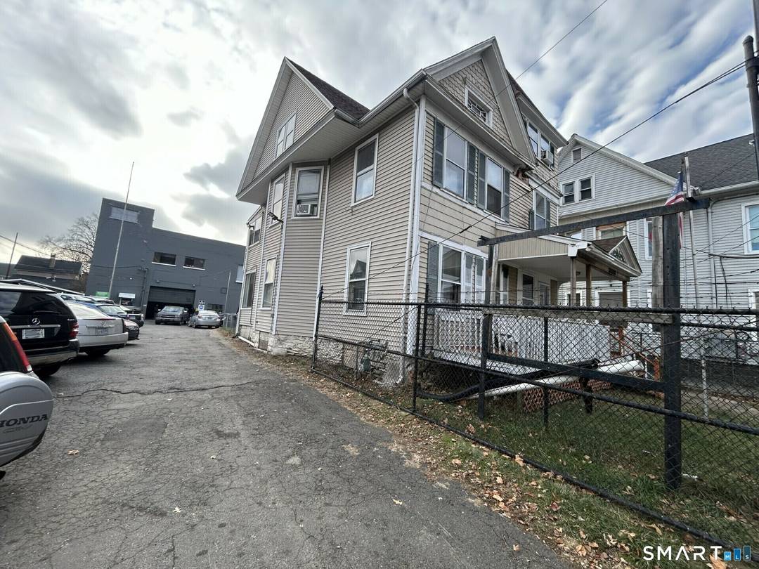 93 105 Wood Ave, Bridgeport, CT A rare opportunity to own a mixed use income and commercial property with two family living plus a massive industrial building in one package.