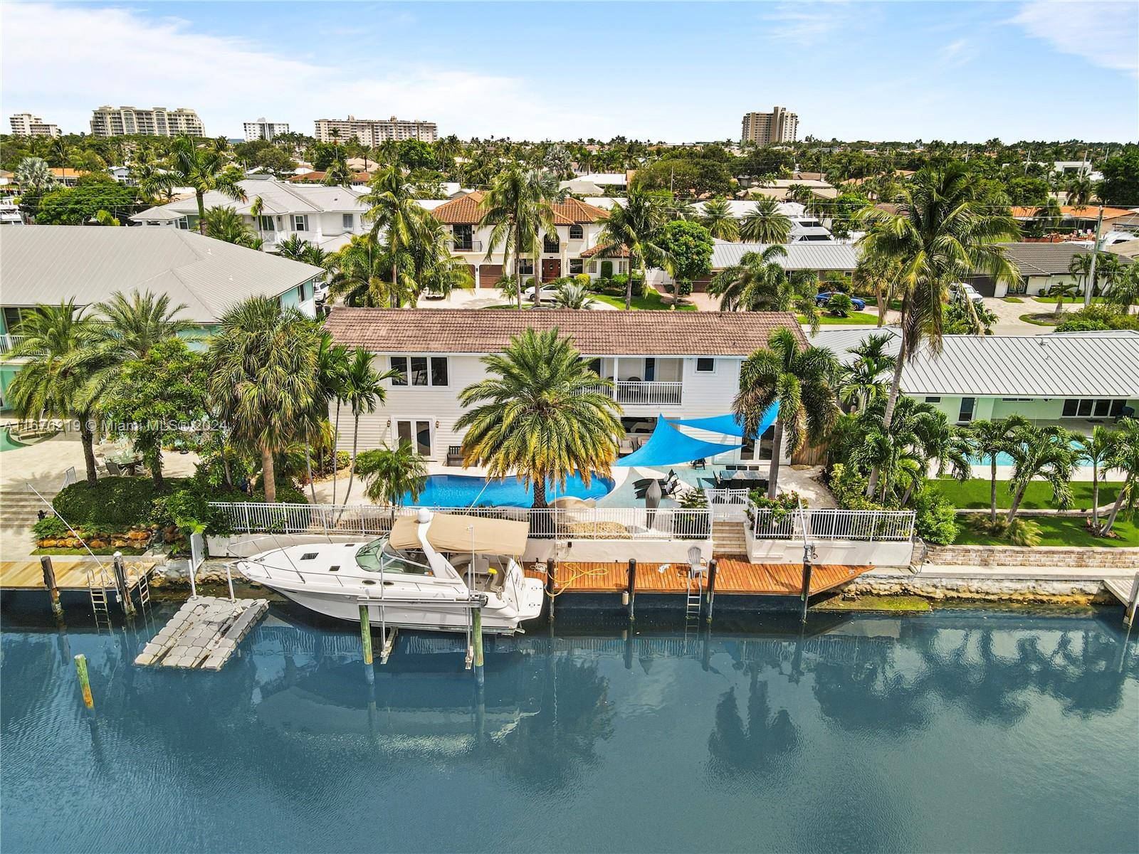 Embrace unparalleled waterfront luxury in this beautifully updated 5 bedroom, 4.