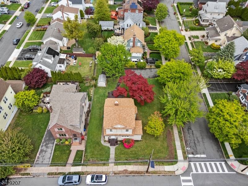 Welcome to this charming 4 bedroom, 2 full bath Colonial situated on a beautiful tree lined street in Nutley.