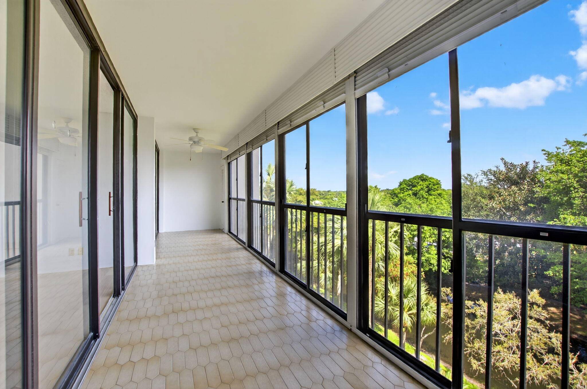 Enjoy expansive treetop and sky views from this 5th floor Laurel Oaks 2 bedroom 2 bath gem awaiting your personal touches.