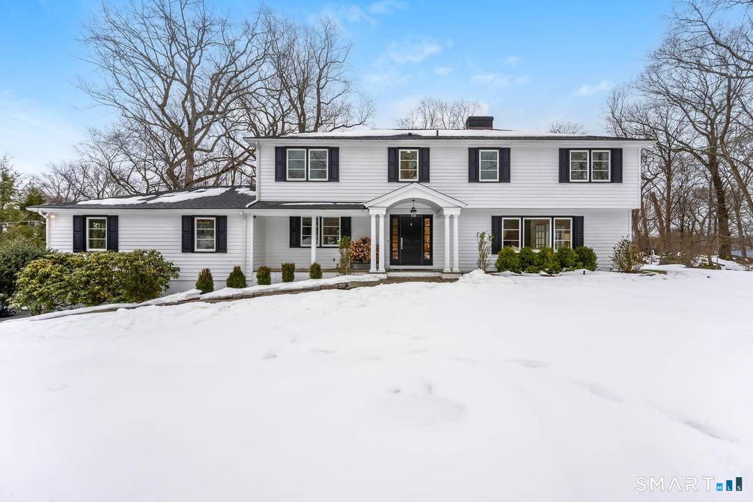 Set on a quiet cul de sac within Darien's prestigious Tokeneke Private Association, this beautifully updated 4 bedroom, 3.