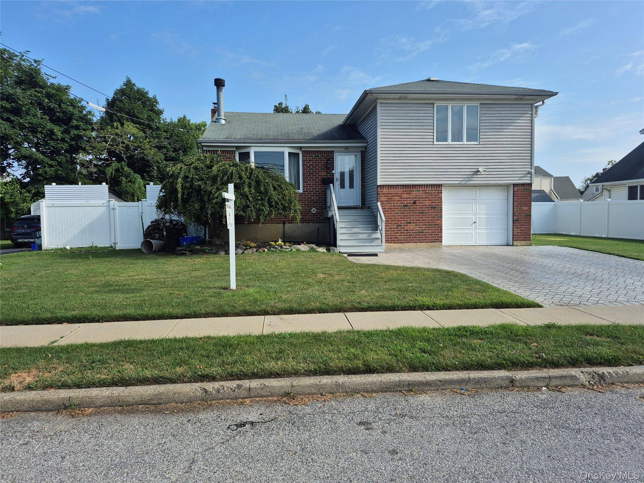 Welcome To This Mid Block 4 Level Split Where Summer Oasis Meets Modern Functionality.