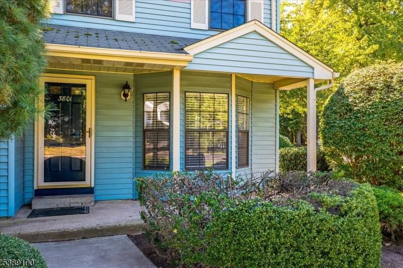 Beautiful NE facing End Unit featuring spacious living room and dining room, EIK opening up to family room with fireplace and sliders leading to patio and garden.