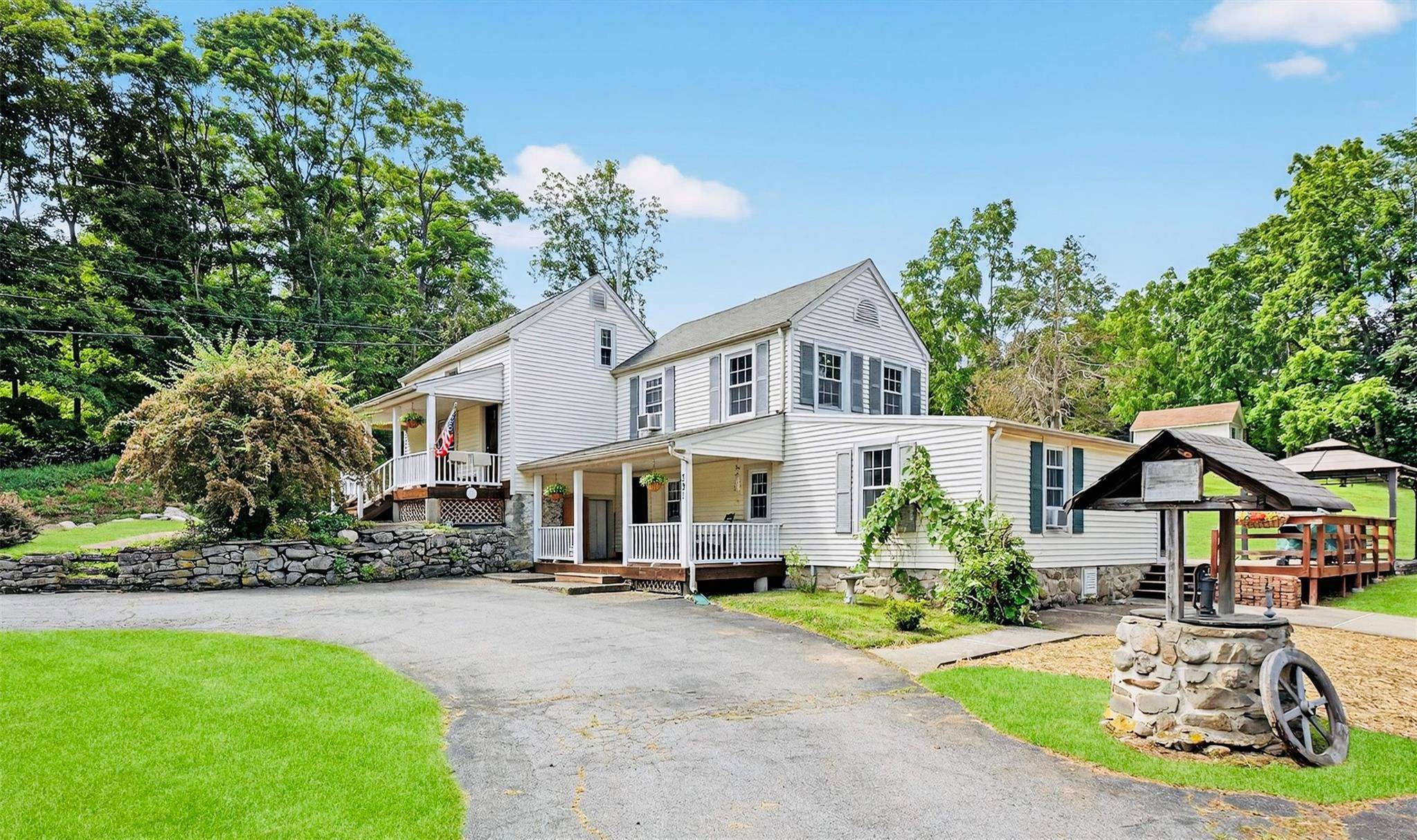 Welcome home to this storybook setting, where a majestic weeping cherry blossom greets you with it's graceful cascade of blossoms each spring.