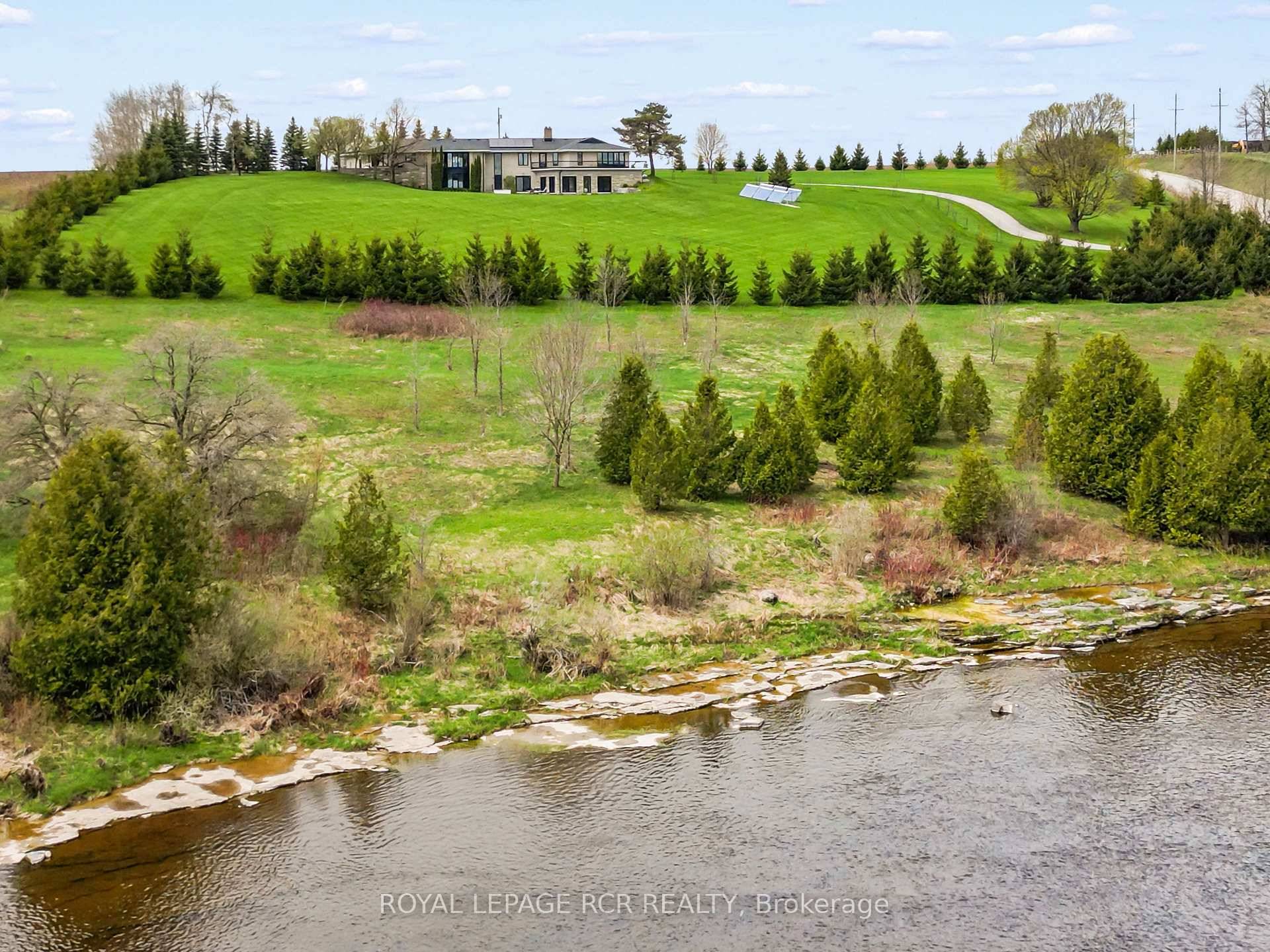 A winding driveway draws you toward The Riverlands, a spectacular Mid Century Modern estate offering over 7, 000 sq ft of total space.