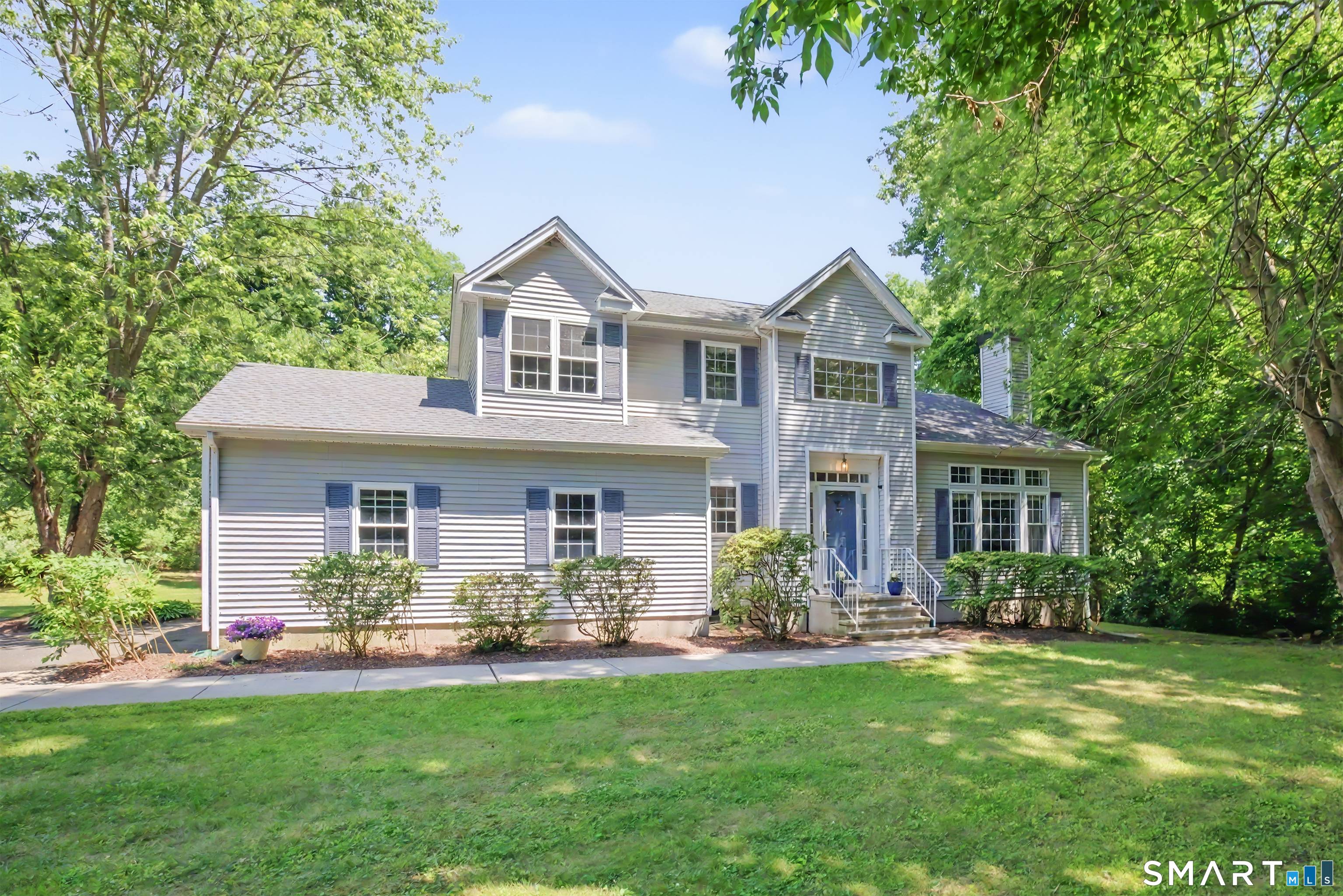 Set on a private, level, almost two acre lot yet close to everything you need is where you will find this wonderful Colonial.