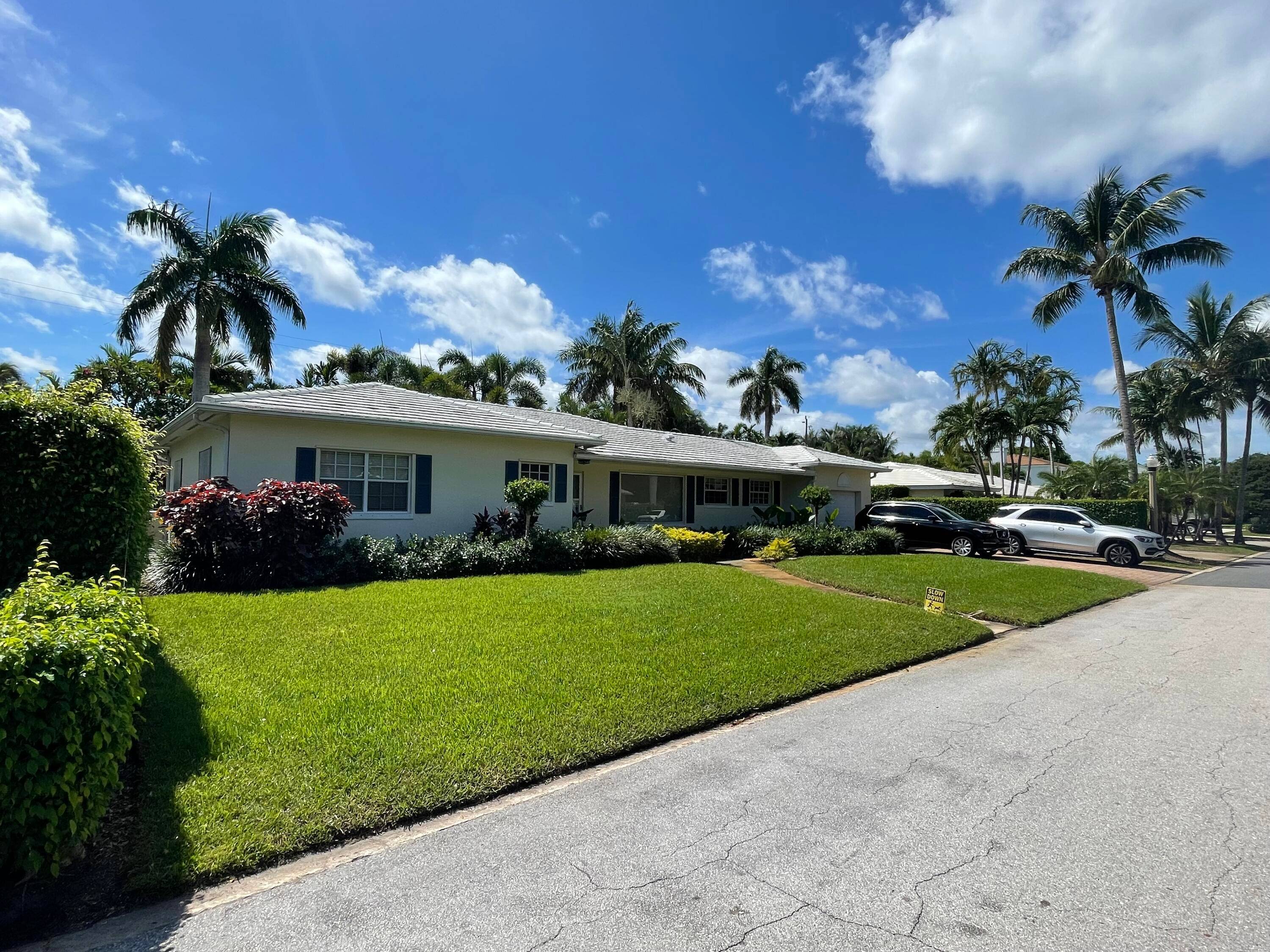 RARELY AVAILABLE SOSO LAKE BLOCK BEAUTIFUL BERMUDA HOME JUST SOUTH OF SOUTHERN BLVD BRIDGE TO PALM BEACH ISLAND.
