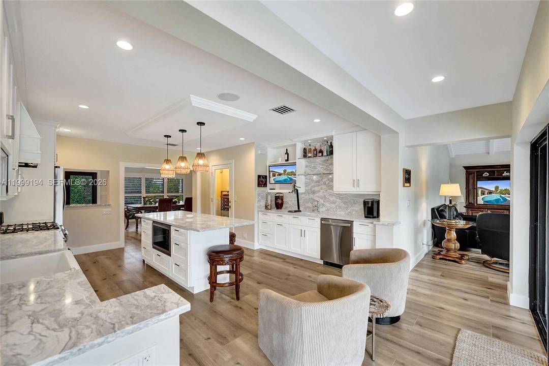The finest Fully Renovated waterfront home in Coral Ridge with Ocean Access offering 100' of Waterfront, no fixed bridges, and a Completely Reimagined Coastal Residence designed for Modern Living and ...