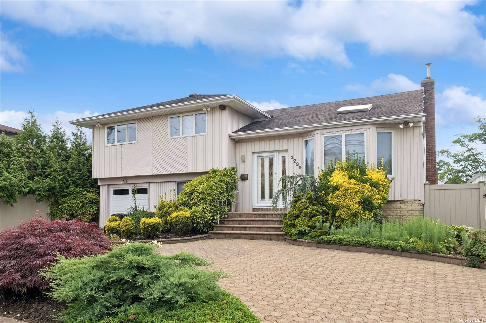Perfect Split Level Home, Just in Time for Summer, with an Abundance of Space, in the Bellmore School District.