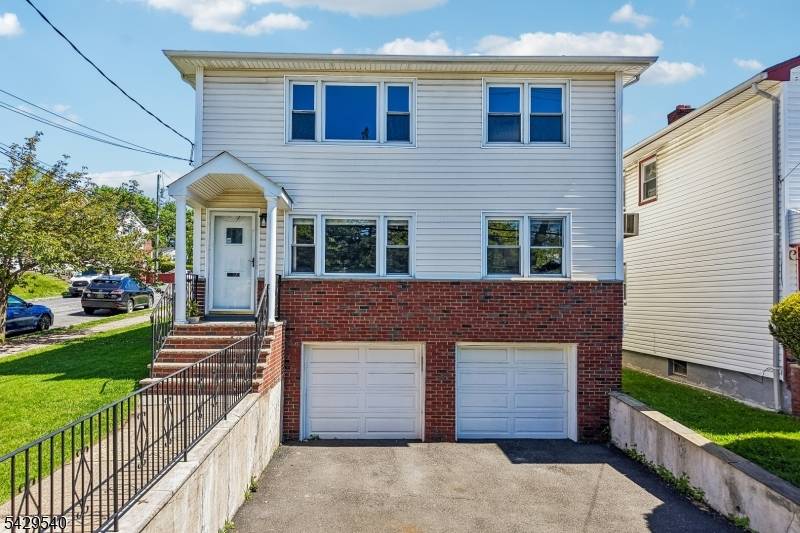 Thoughtfully updated 2 family home in one of Maplewood's most convenient neighborhoods.