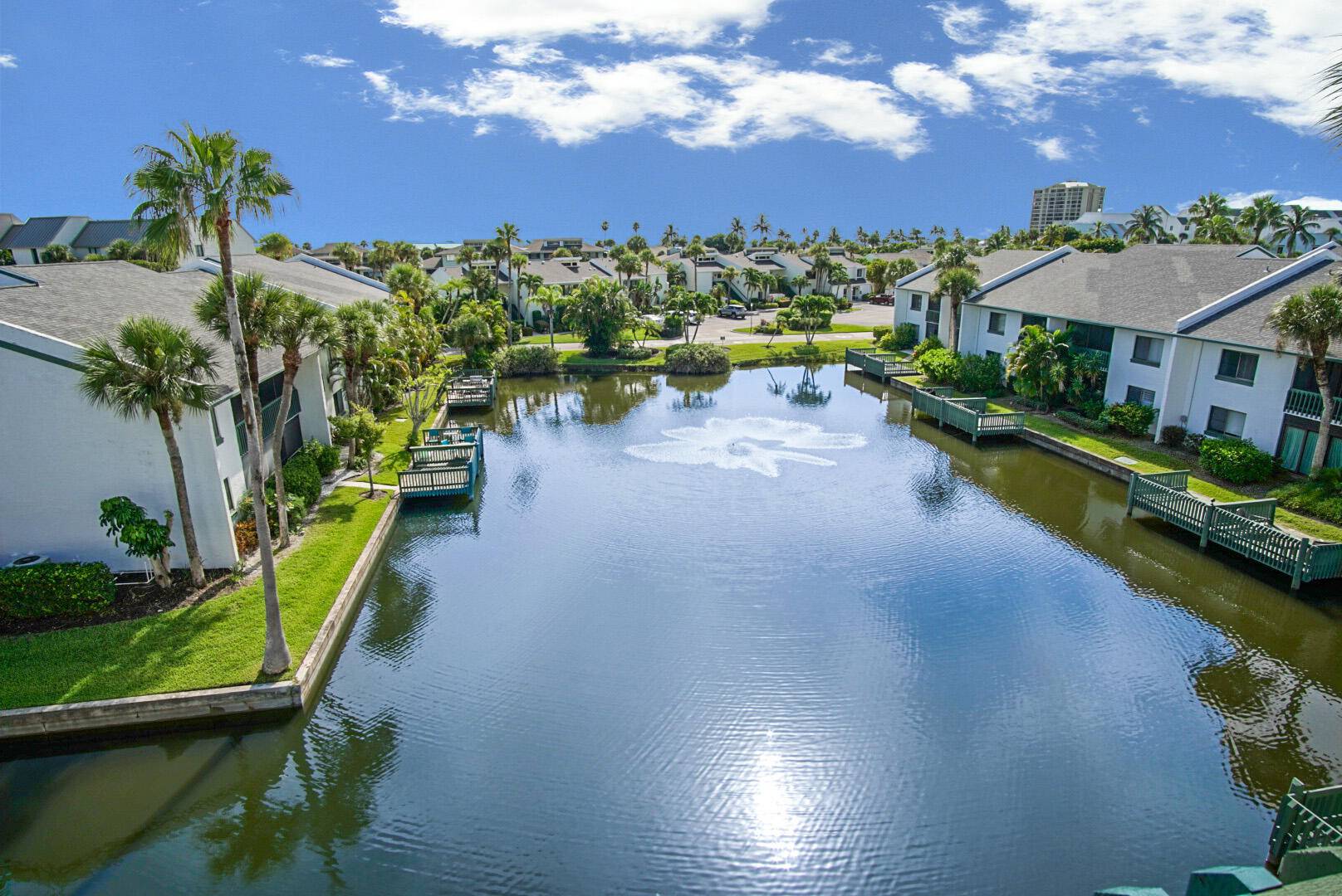Gorgeous 4th floor 2 bed 2 bath unit features a beautiful quiet view from lanai overlooking the pond with slight ocean view.