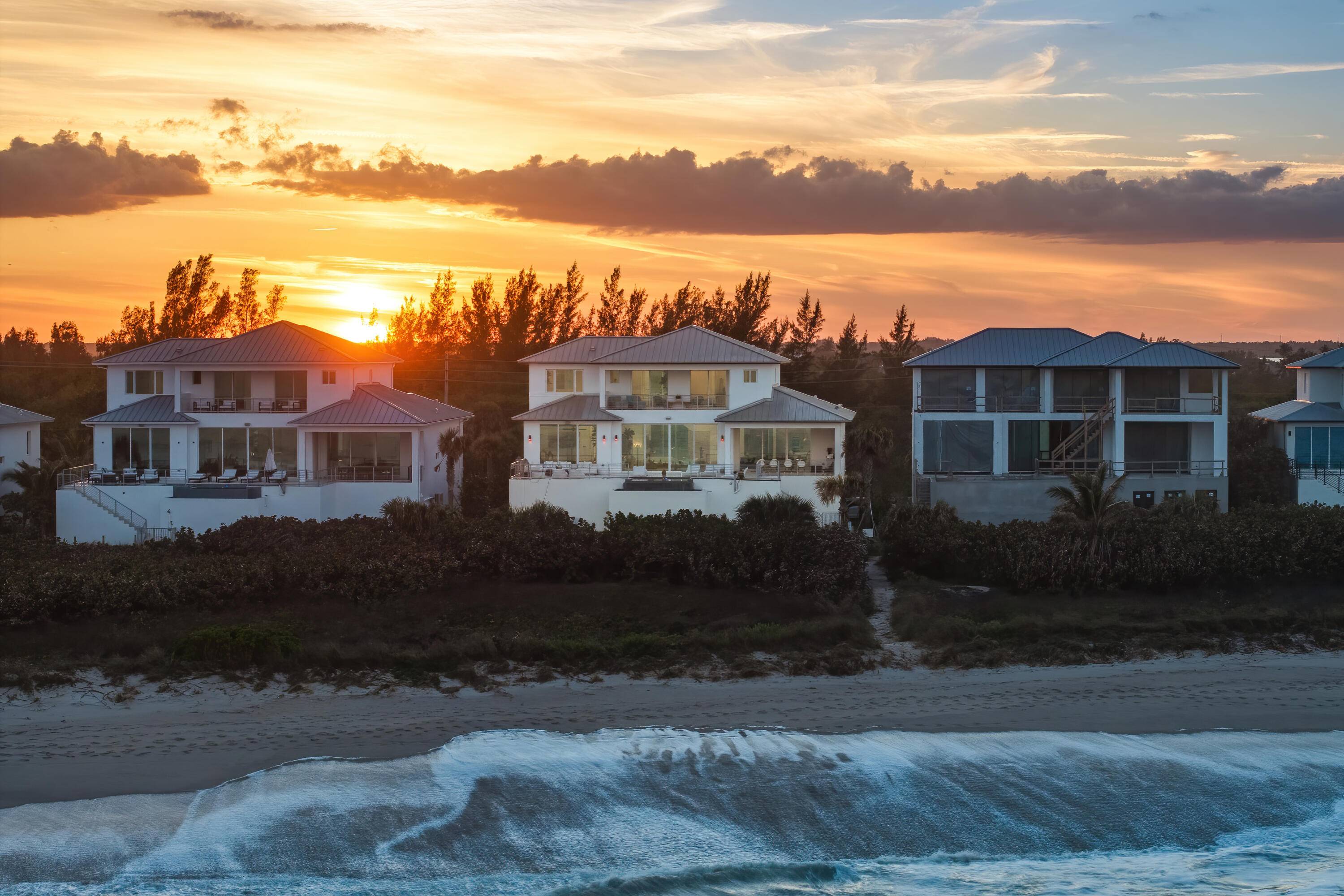 Indulge in coastal luxury with this newly built in 2022, over 10, 250 tot sq', oceanfront retreat in the Aquavista community of North Hutchinson Island.