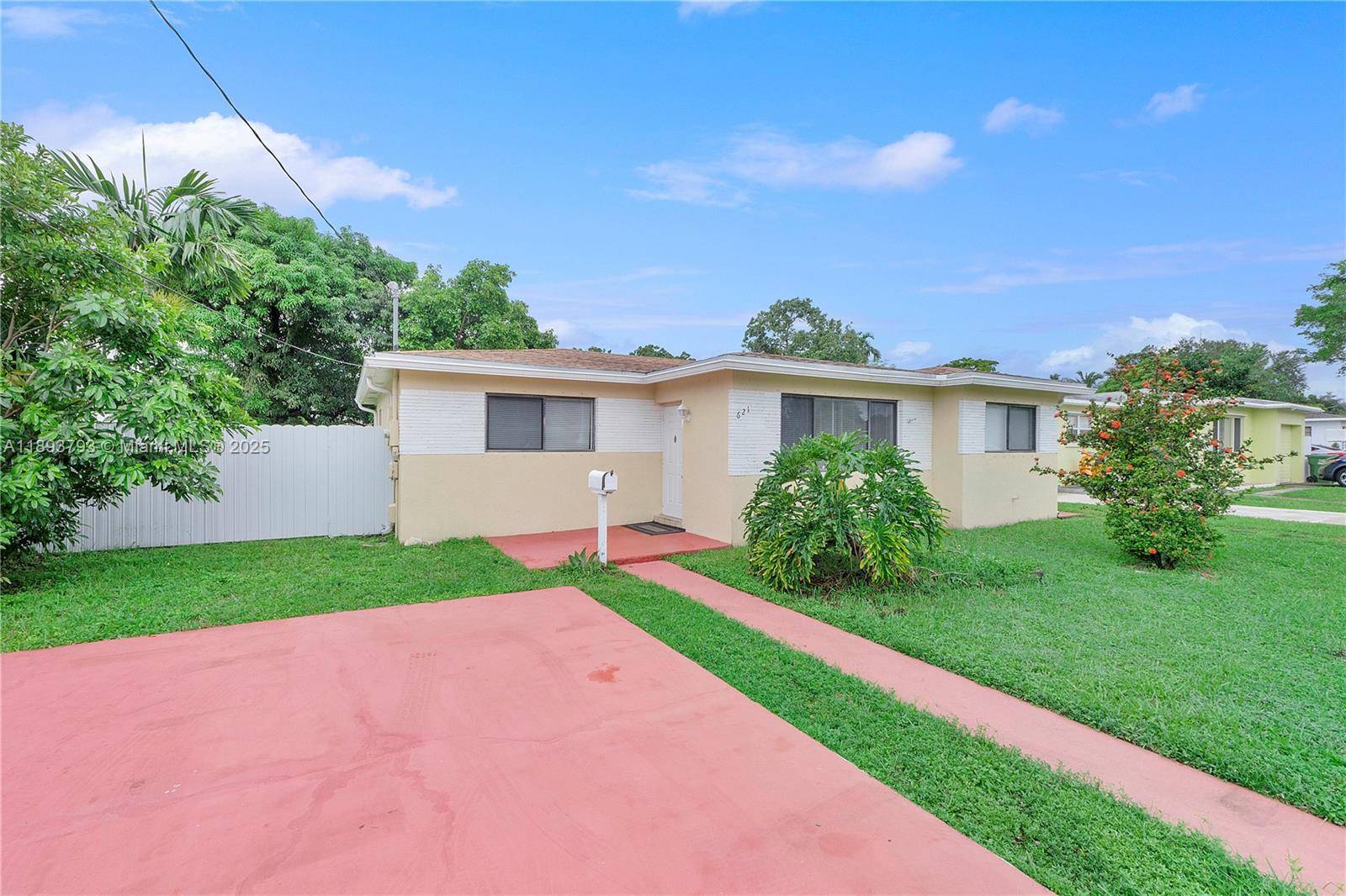 Charming 3BR 2BA home in Hallandale Beach featuring an open concept layout, a nice sized yard, and a 4 year old roof and HVAC.