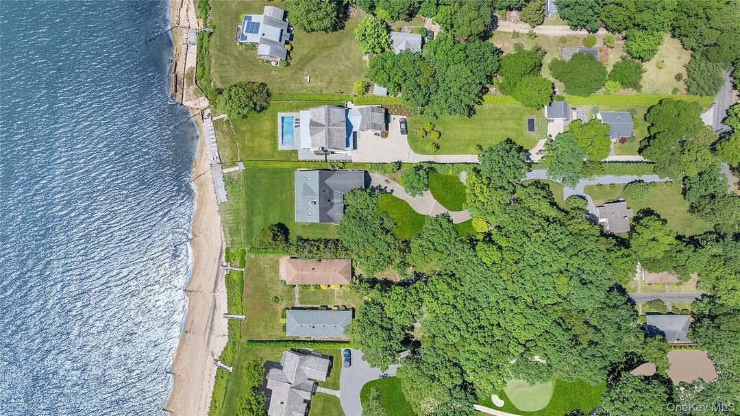 Welcome to a unique luxury waterfront estate, perfectly situated overlooking the Peconic Bay, with stunning views of Robin's Island and the Hamptons.