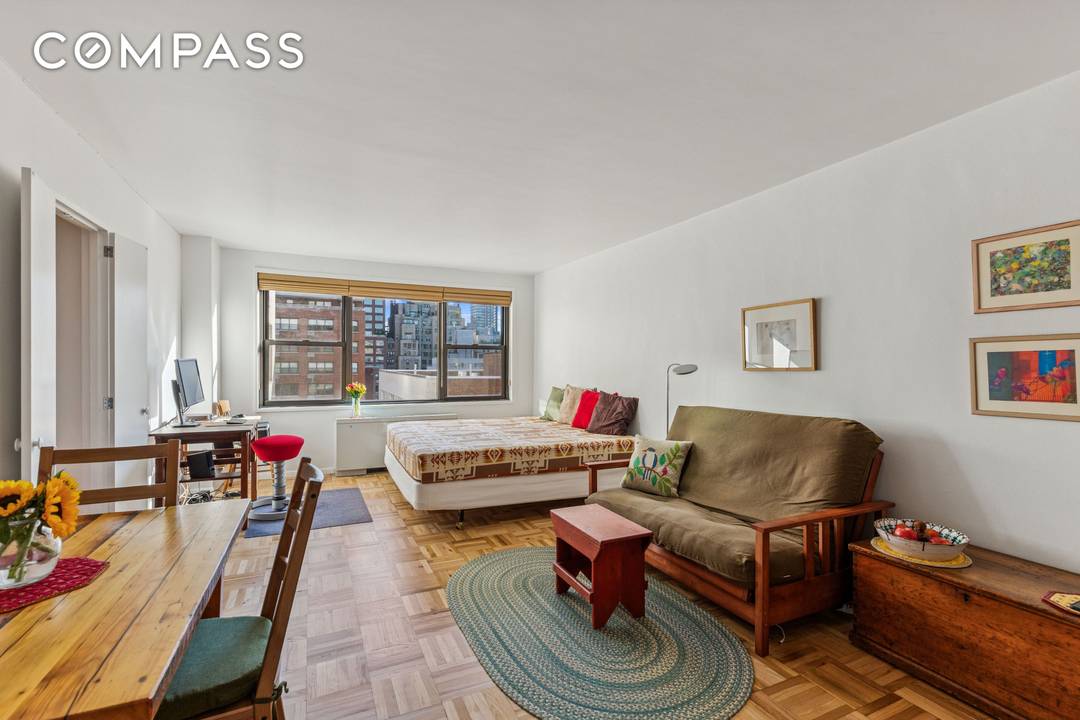 LOCATION and VALUE move in ready studio in full service building !