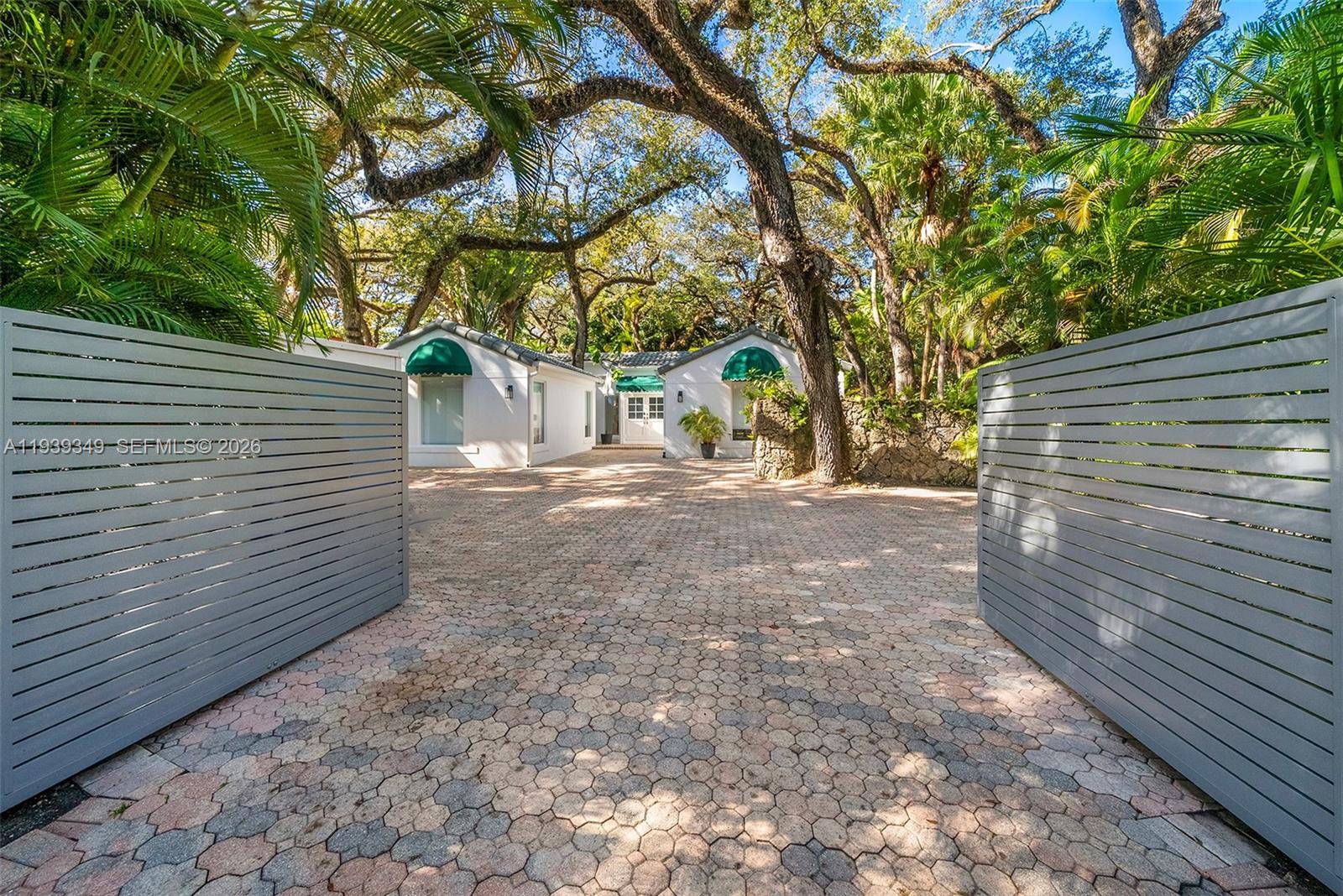 Nestled in the desirable South Coconut Grove neighborhood, this 4 bedroom, 2.
