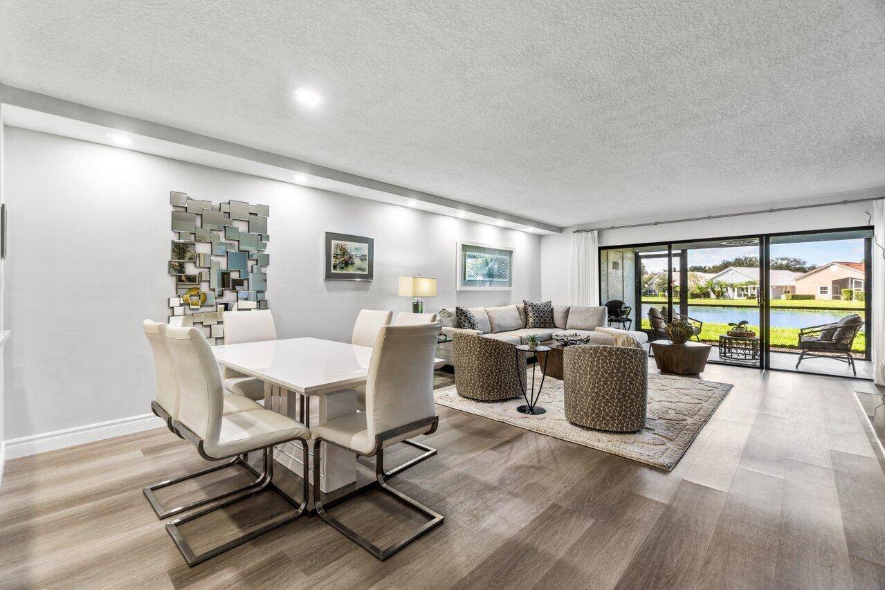 Must see absolutely gorgeous fully renovated 1st floor condo situated on a premier water lot w expansive lake views !