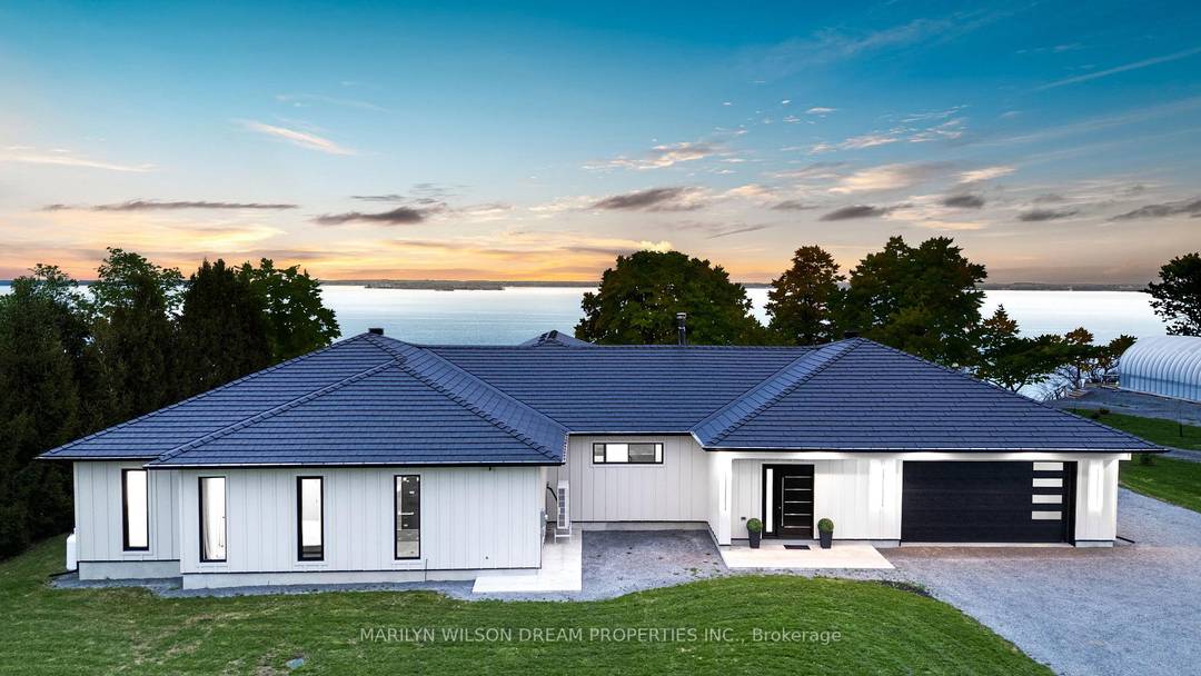 Perched above the St. Lawrence River on Howe Island, this is not simply a waterfront home, it is a deliberate retreat from the expected.