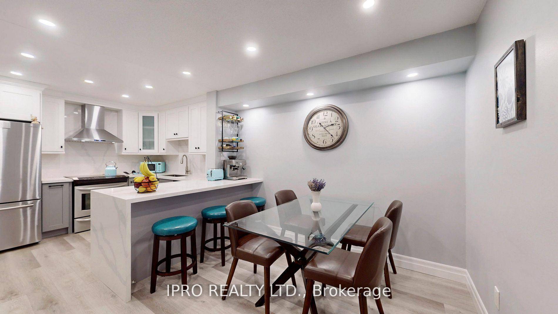 Welcome to this bright, impeccably renovated three bedroom townhouse in the heart of Aurora Village.
