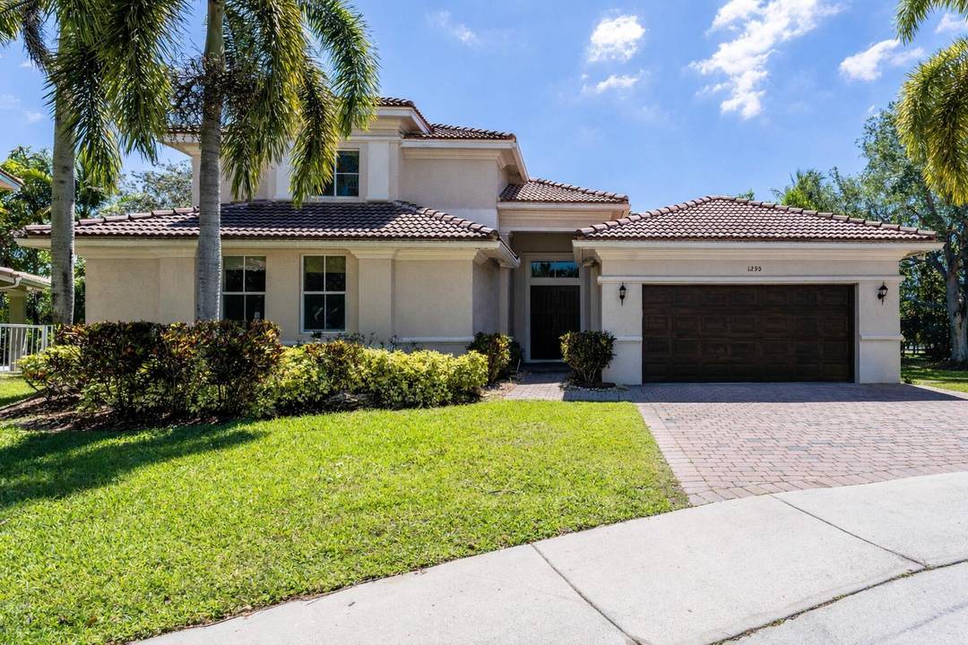 Set along a serene waterfront in the highly sought after Savanna community of Weston, this exceptional 5 bedroom, 3.