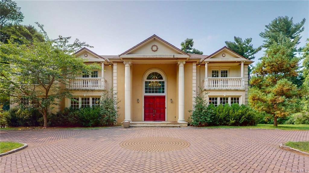 This gracious 5 bedroom, 4 bath colonial sits on over an acre in Sands Point.