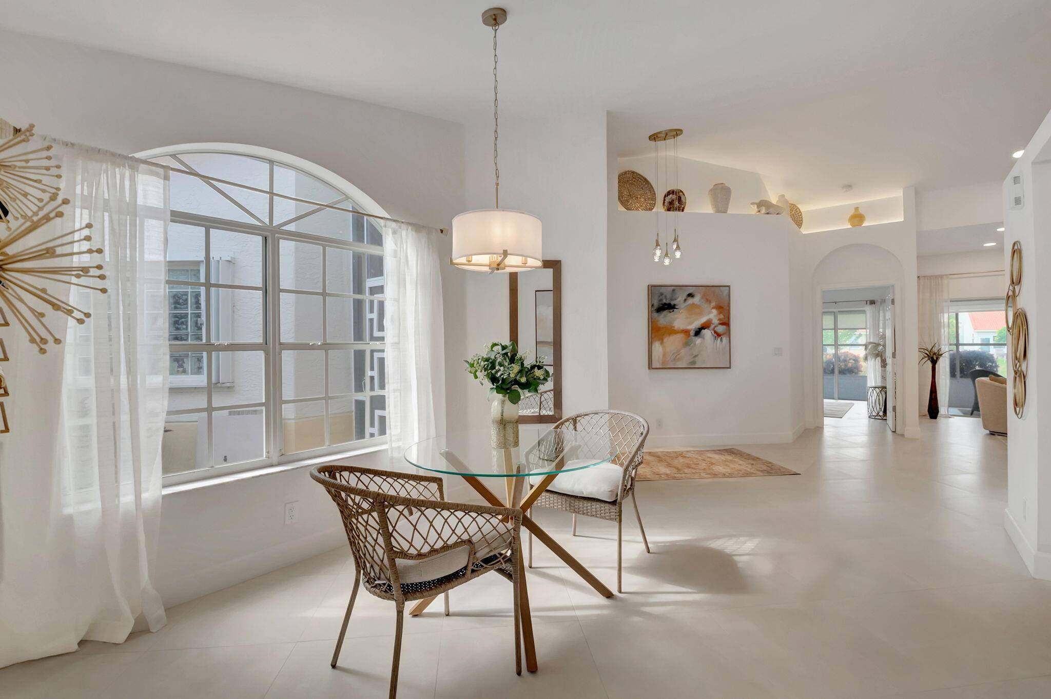 COMPLETELY RENOVATED BEAUTIFULLY APPOINTED VILLA ON A LAKE, 3 BEDROOMS, 2 BATHS, NEW ROOF IN 2022.