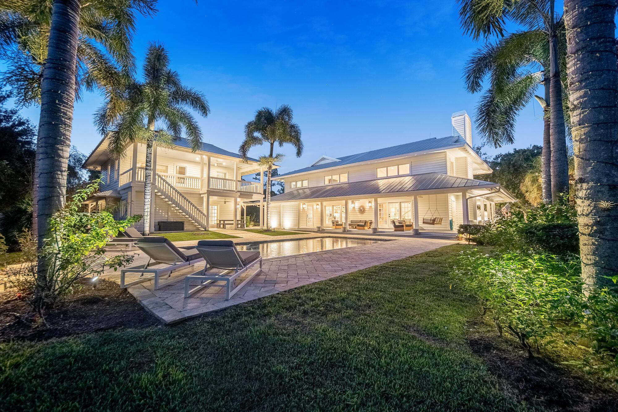 Experience the rustic charm and modern comforts at this exquisite Palm Beach meets Palm City estate.
