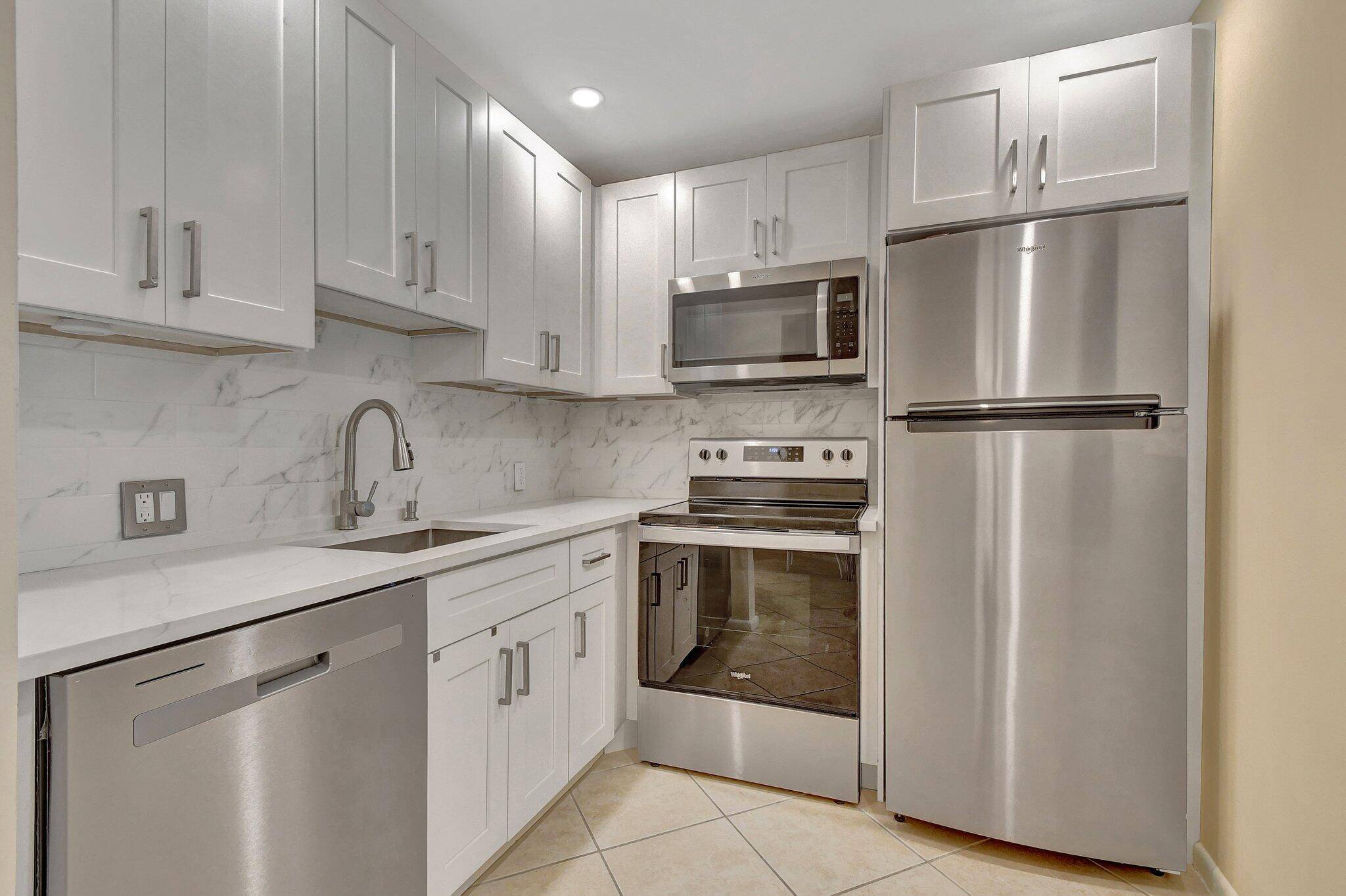 GORGEOUS RENOVATED 2ND FLOOR CONDO BREATHTAKING GARDEN VIEWS NO RENTAL RESTRICTIONS CAN RENT RIGHT AWAY Move in ready 55 community.