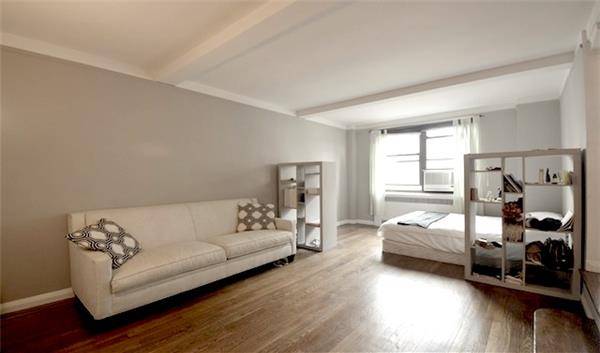 Bi level studio in sought after Kensington House, a fabulous full service Art Deco building in prime Chelsea.