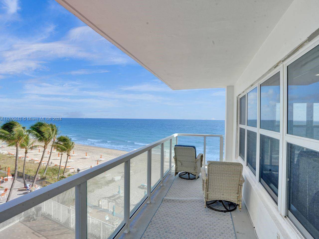 Experience the epitome of coastal luxury with this stunning, completely redesigned three bedroom residence with unobstructed, direct oceanfront views.