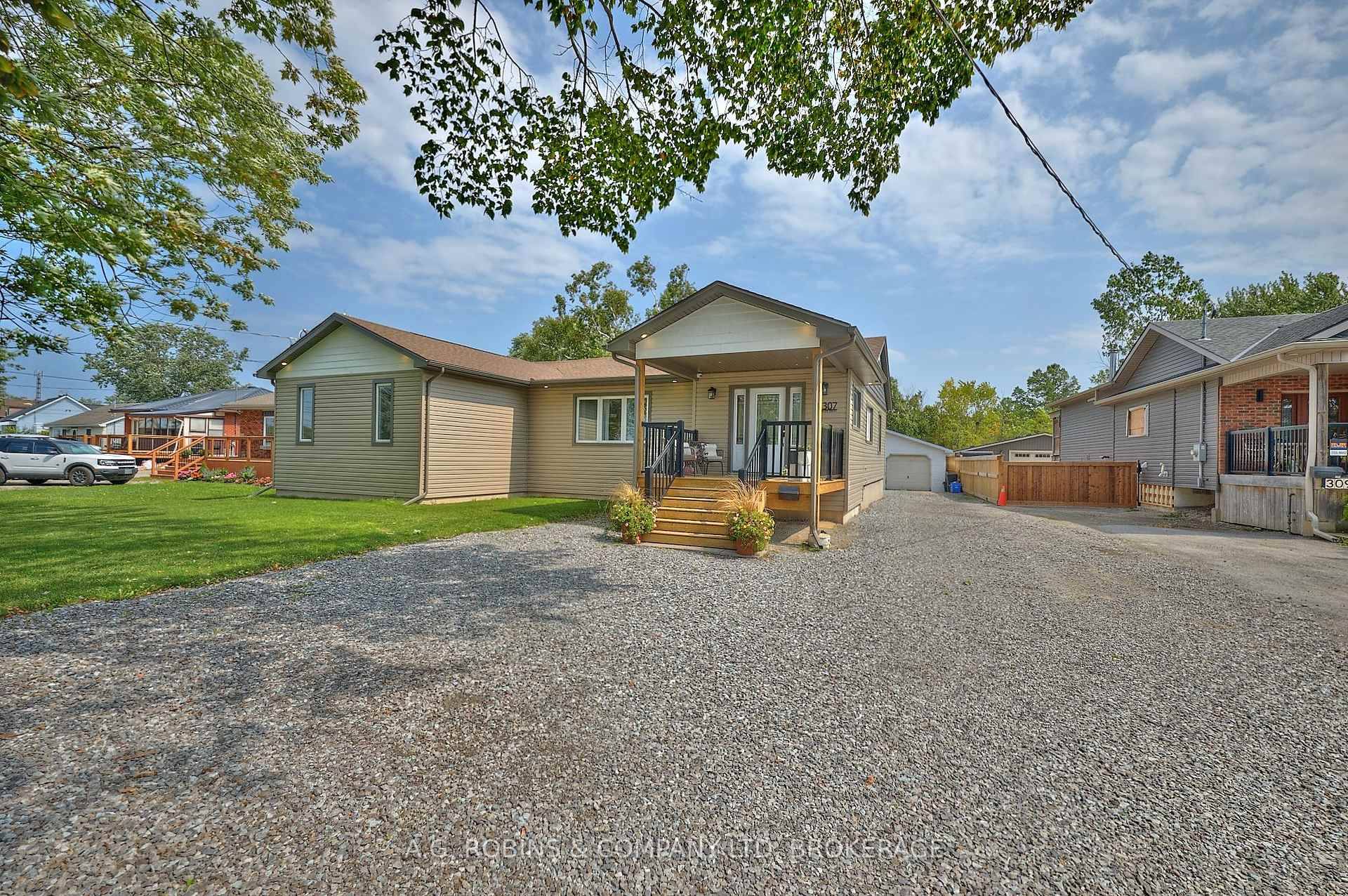 Welcome to 307 Riverside Drive, a spacious and sun filled bungalow offering over 1, 850 sq.