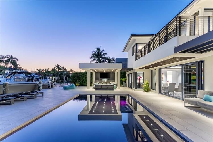 Modern luxury living in security gated Keystone Point with partial open bay views.