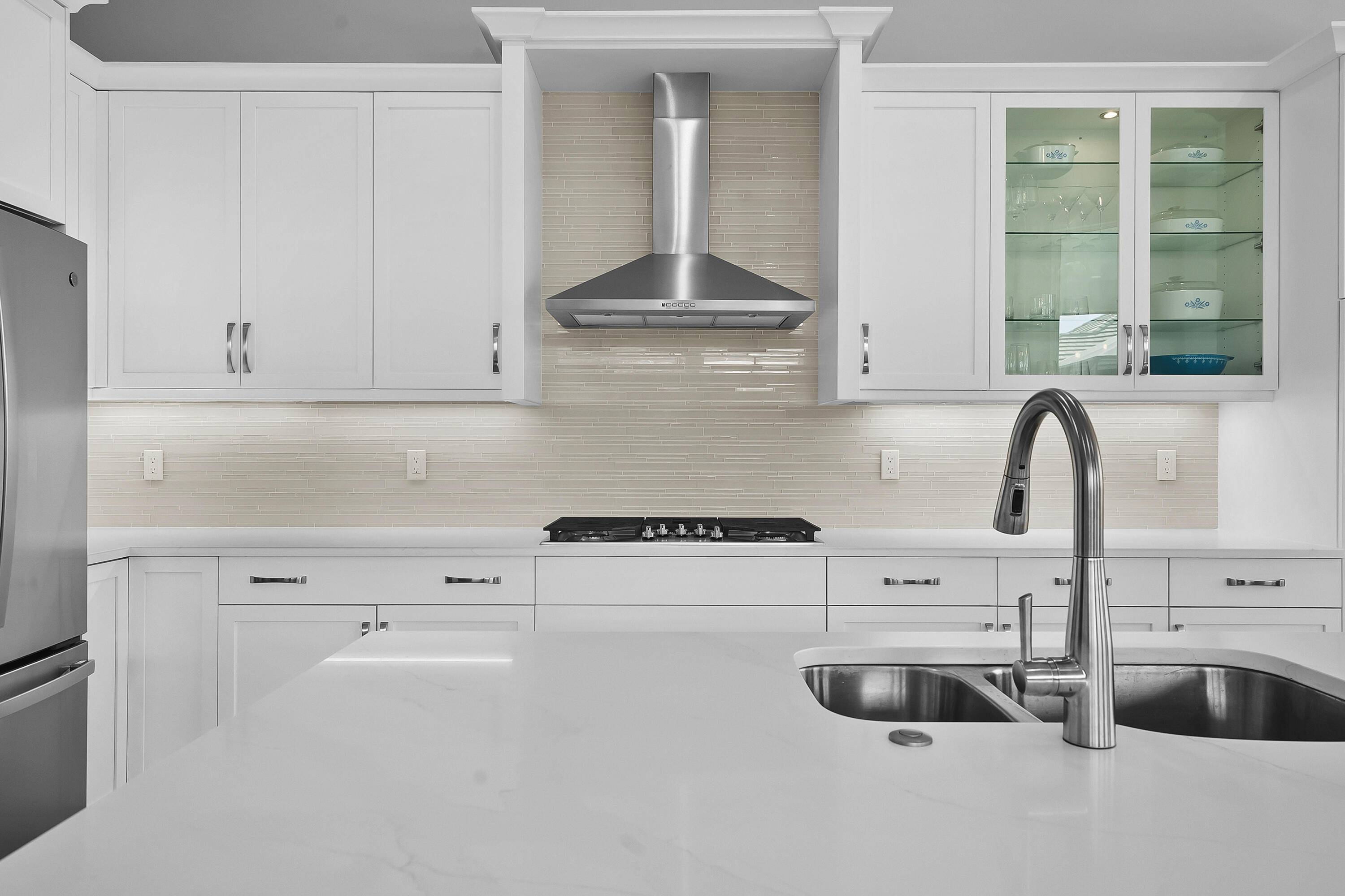 Welcome home to this black white contemporary new construction pool home w 70ft of waterfrontage lake views.