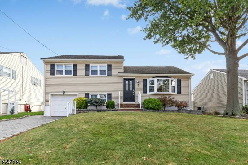 Lovely, well maintained home featuring a bright and inviting living room with a large picture window that fills the space with natural light and opens to the formal dining room, ...