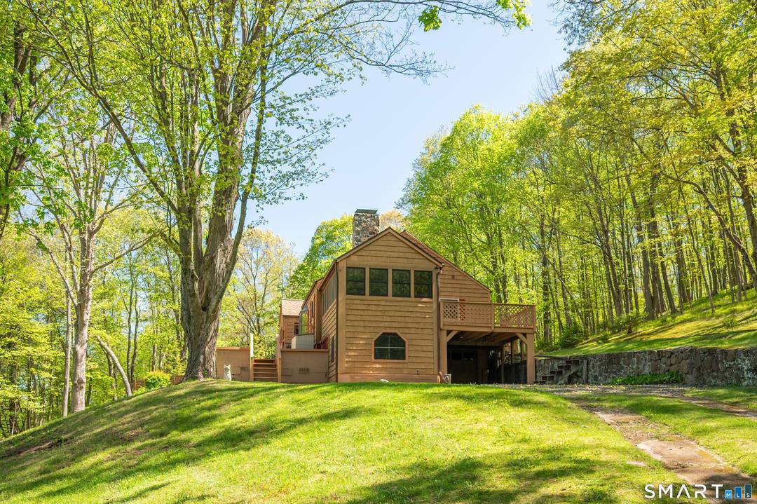 Privately positioned on over 5 secluded acres on Danbury's coveted west side, this elevated residence commands the landscape w quiet confidence.