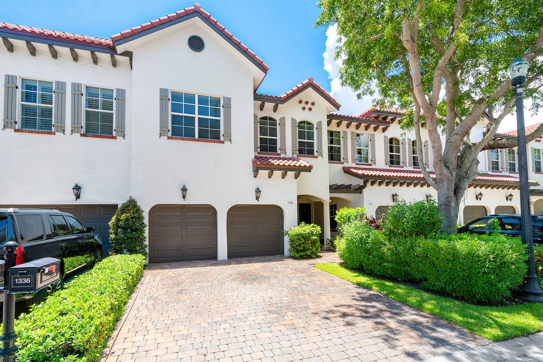 Rarely available three story townhouse in desirable gated community, Estuary of Delray Beach.