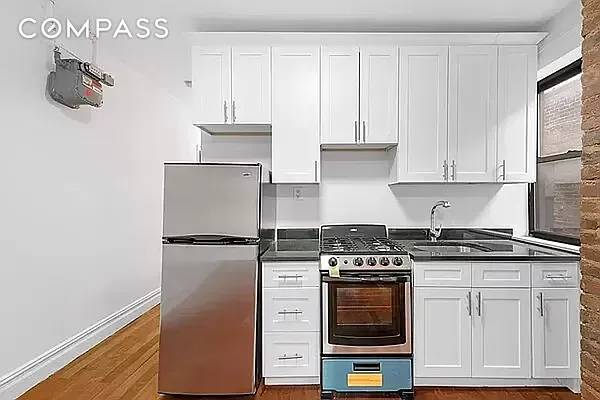 Spacious 2BD 1BA with renovated, eat In Kitchen, high ceilings, and hardwood floors.
